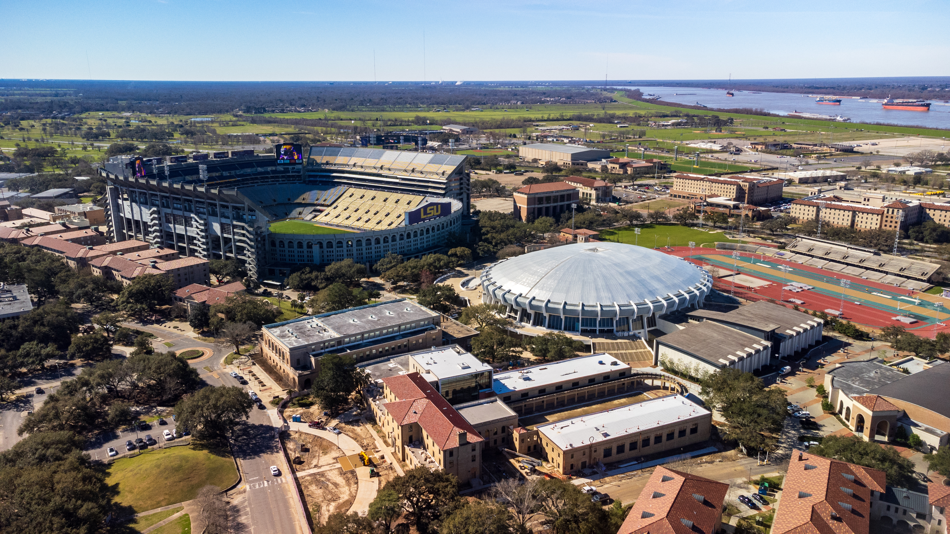 Baton Rouge, LA - February 2023: The Pete Maravich Assembly Center and Tiger Stadium on LSU campus in Baton Rouge, LA