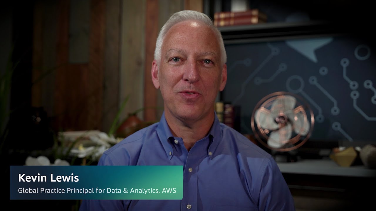 YouTube video thumbnail featuring Kevin Lewis, Global Practice Principal for Data & Analytics at AWS, seated in front of a technical-themed background.