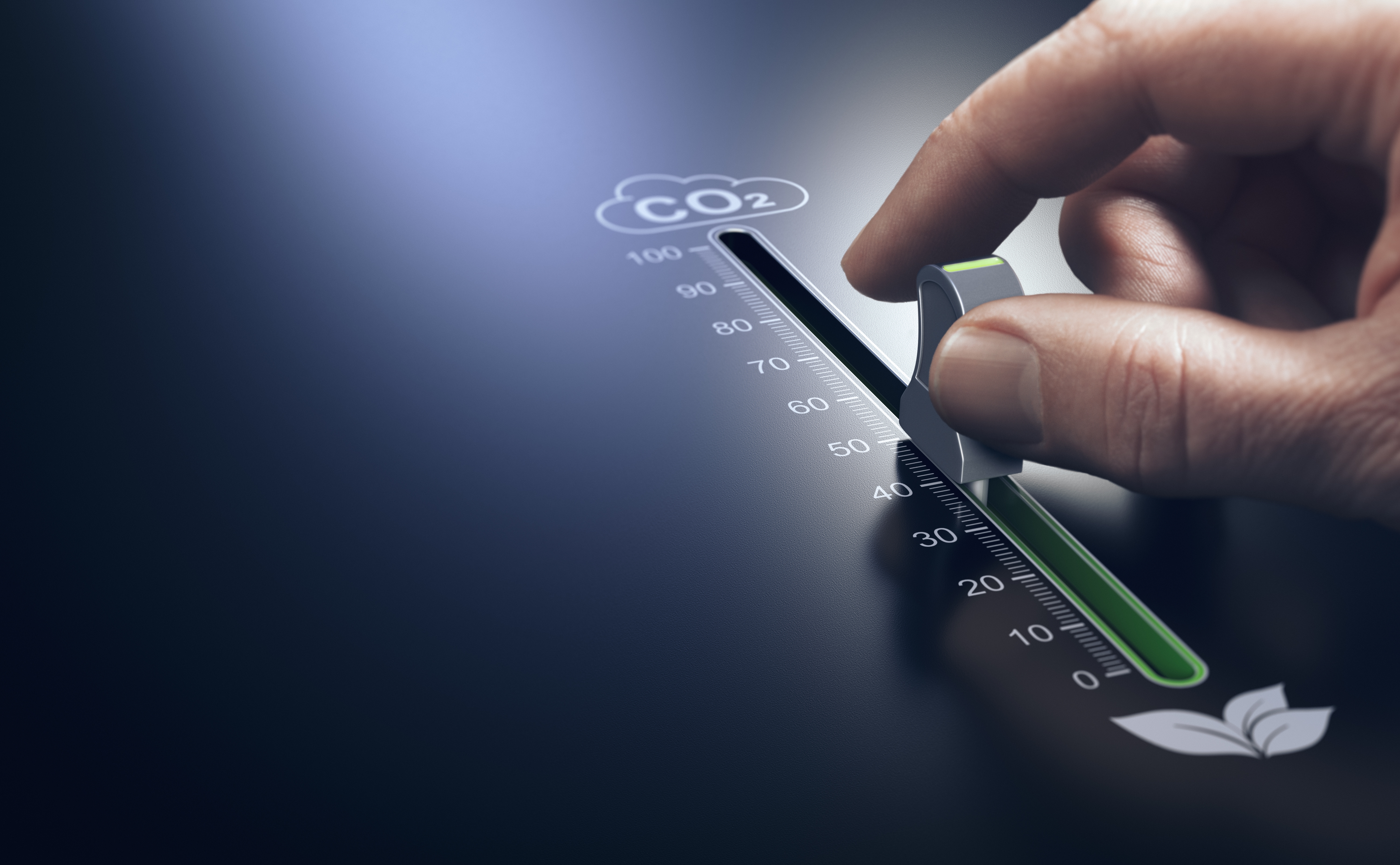 Hand using a slider to reduce CO2 emissions. Carbon free energy. Concept of decarbonization.; Shutterstock ID 2256892601; purchase_order: Sweep case study; job: AWS; client: Case study; other: EMEA