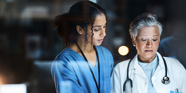 Women, doctors and tablet for night medical research, surgery planning and teamwork in hospital. Nurse, healthcare and worker collaboration on technology in late shift for wellness thinking and ideas.