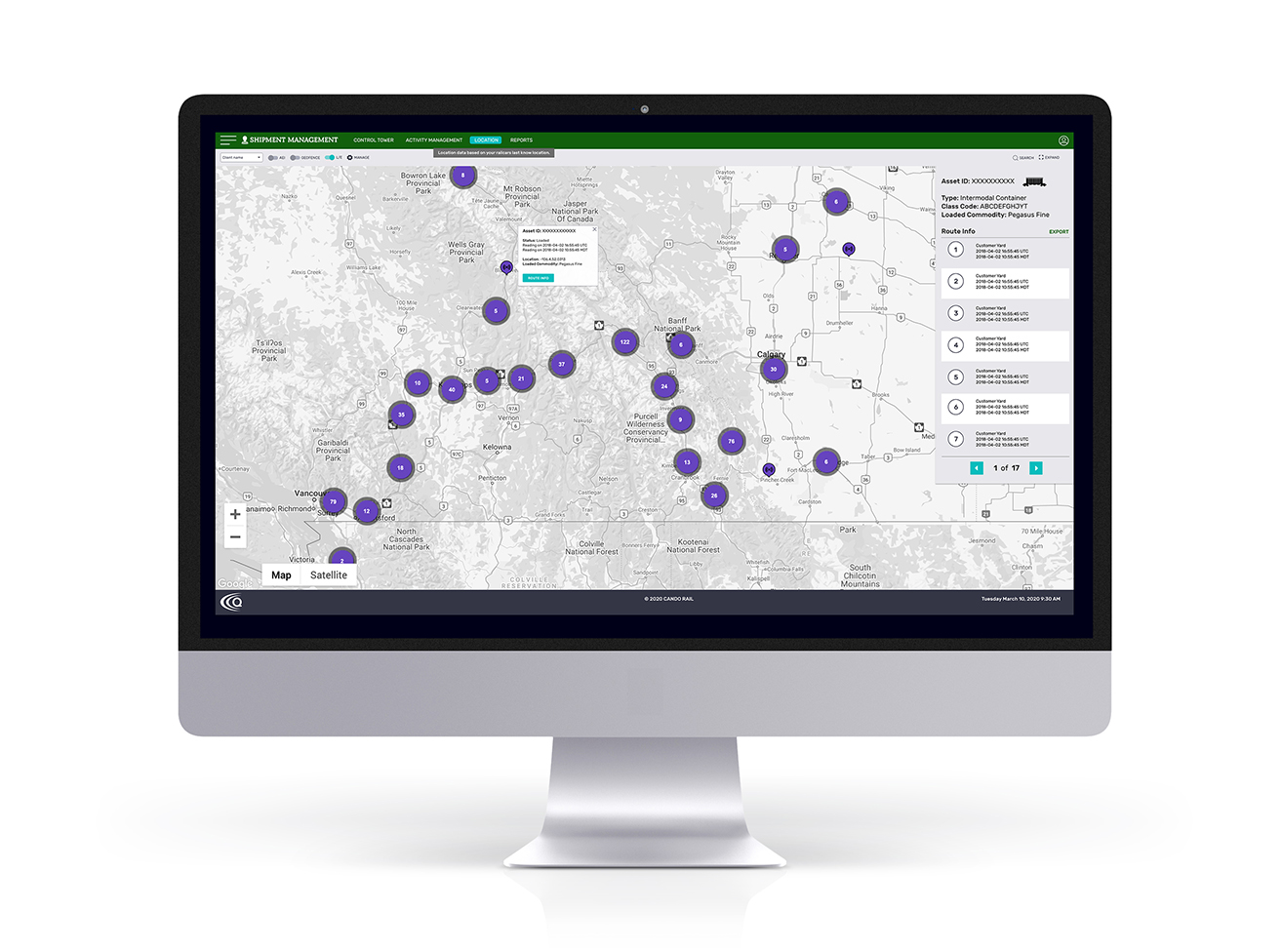 A desktop computer monitor displaying a shipment management dashboard with a route map and asset tracking information. The interface shows tracking points and route details for logistics and transportation management.