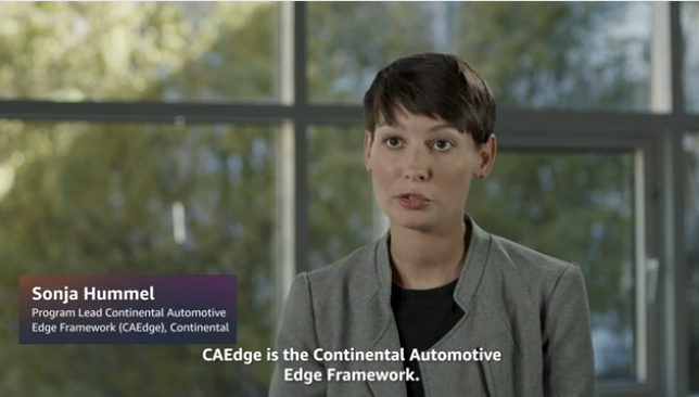 Sonja Hummel, Program Lead at Continental Automotive Edge Framework (CAEdge), Continental, discusses the Continental Automotive Edge Framework in an interview setting, with a background of large windows and trees visible outside.