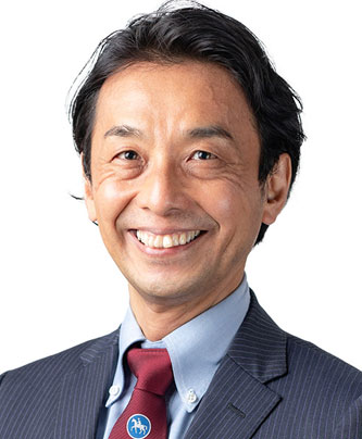 Professional business portrait of a male speaker in a suit and tie, used for the Akase case study.