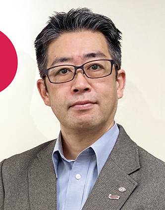 A business professional wearing glasses and a suit jacket, facing the camera with a neutral background. This image is used for a solution case study.